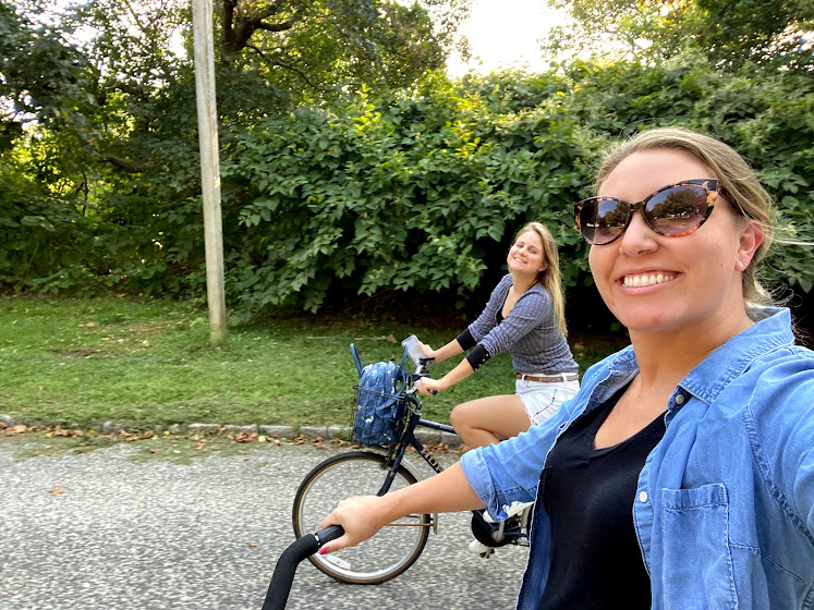 Weekend in The Hamptons: Two girls riding bikes in Southampton, New York