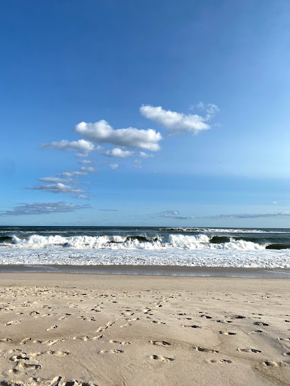 Weekend in The Hamptons: Sandy beach and waves coming in at Cooper's Beach in Southampton, New York