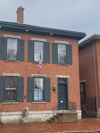 Brick house in German Village with blue and yellow candles